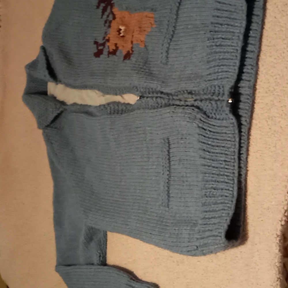 Vintage hand made cardigan sweater. Back 30 ",sleeve 32",CHEST 25".